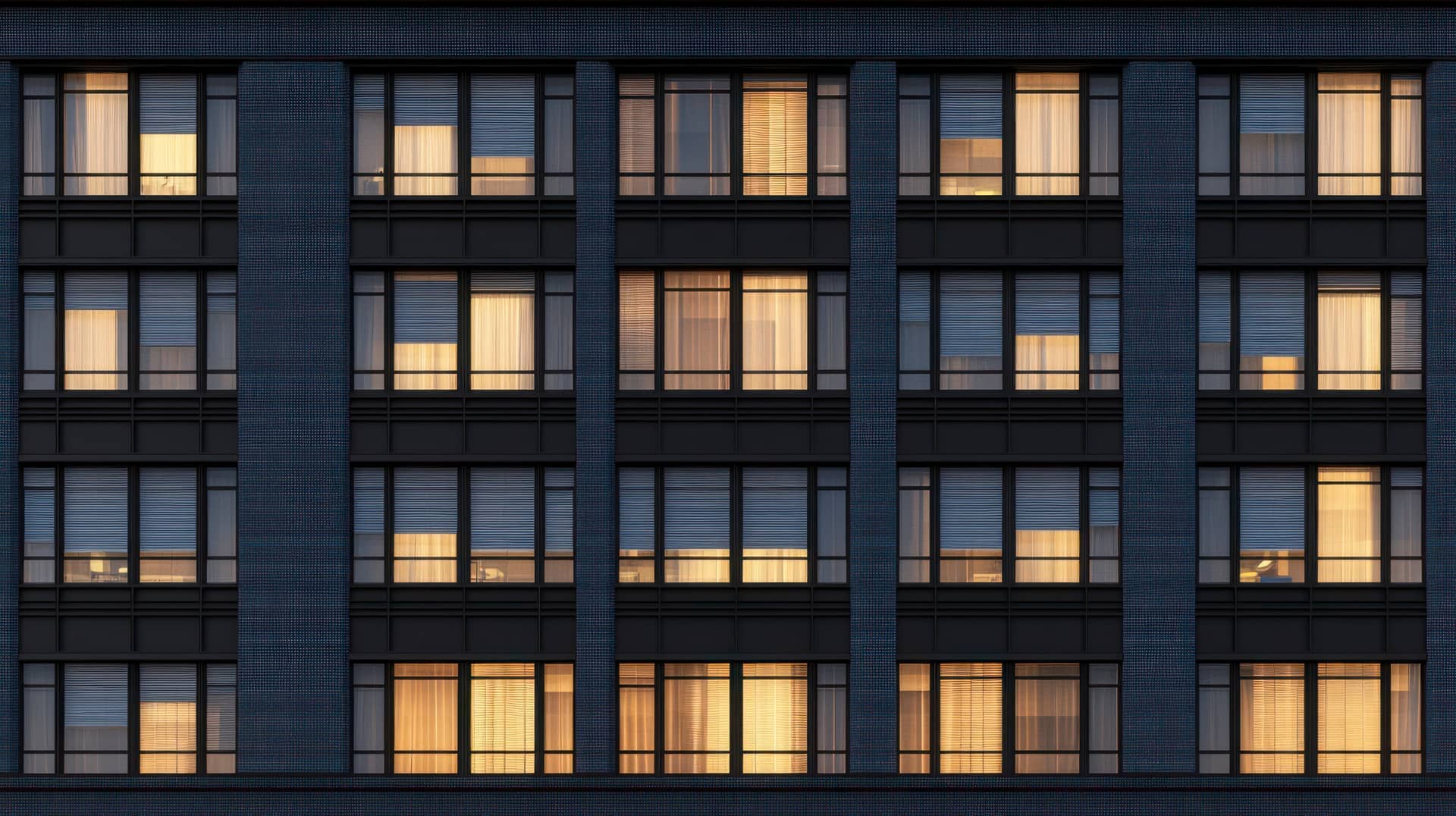 A New York City residential building lit at dusk